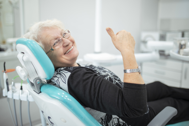 Older woman patient giving thumbs up