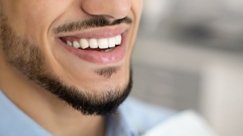 Close-up of a smiling bearded man