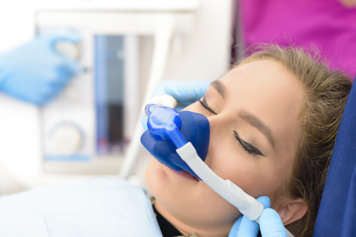 Patient receiving dental sedation treatment.